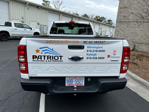 Vinyl lettering and graphics on Roofing Exteriors Truck